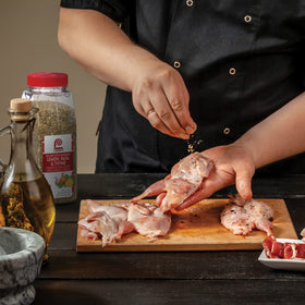 Lawry's Key West Lemon Basil Thyme seasoning rub applied to chicken for Mediterranean depth.