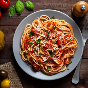 Lawry's Original Spaghetti Sauce spices close-up onions and garlic for authentic flavor.