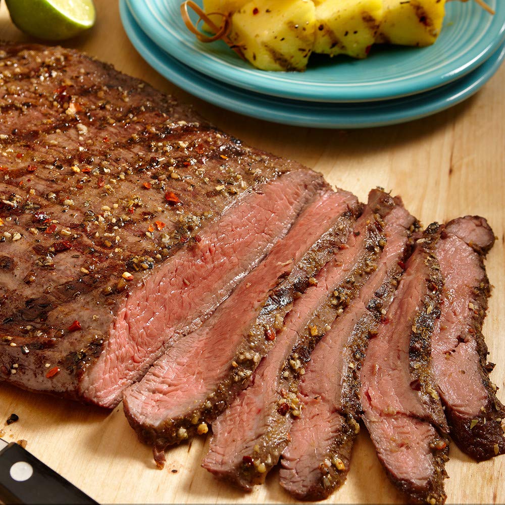Lawry's marinade ready steak on grill with flavorful sear