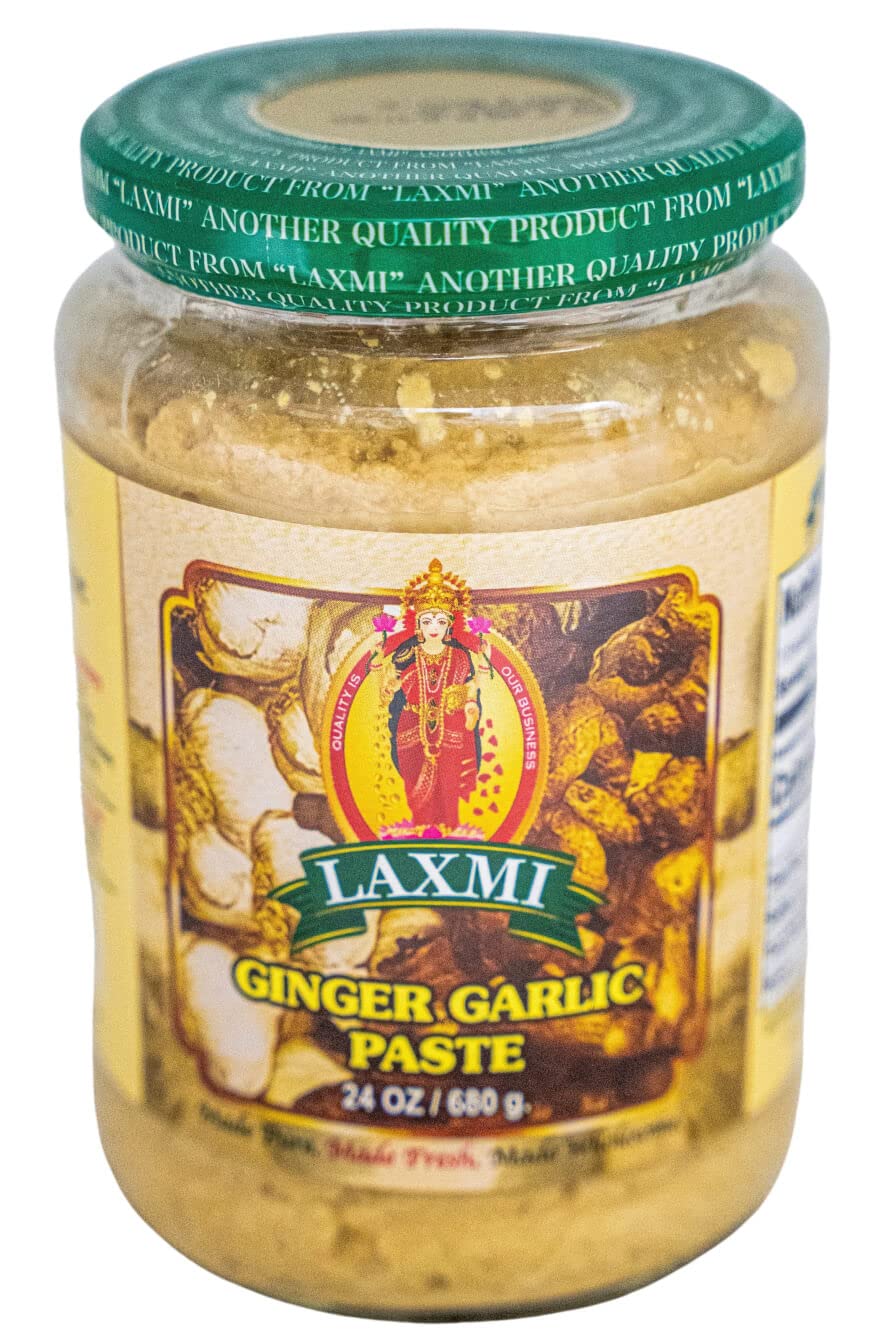 Laxmi Ginger Garlic Paste bottle on kitchen counter, ready-to-use flavor base.