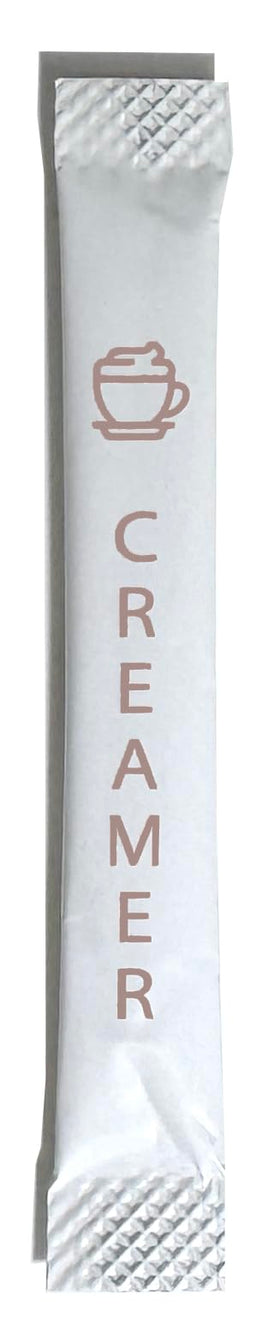 Le Must non-dairy creamer packets arranged in a row for quick, single-serve coffee enhancement.