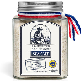 Le Saliculteur de Guerande grey sea salt jar on kitchen shelf, ideal for finishing dishes.