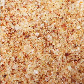 Kitchen scene with Le Saunier de Camargue Espelette Chili salt on counter.