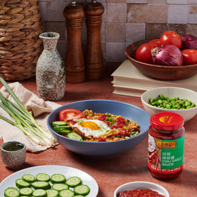 Lee Kum Kee Chili Garlic Sauce served beside noodles for savory kick