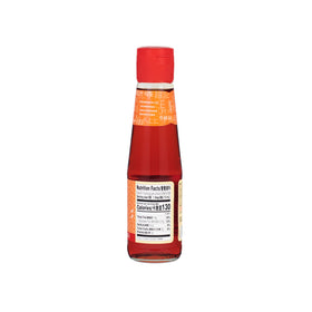 Lee Kum Kee Chili Oil label closeup shows vibrant red hue and premium ingredients.