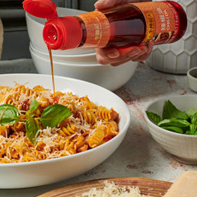 Lee Kum Kee Chili Oil noodles bowl enhances spicy, fragrant noodles.