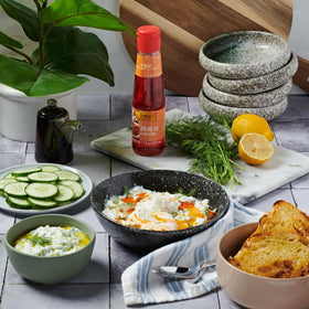 Lee Kum Kee Chili Oil vibrant red hue signals bold, appetizing aroma.