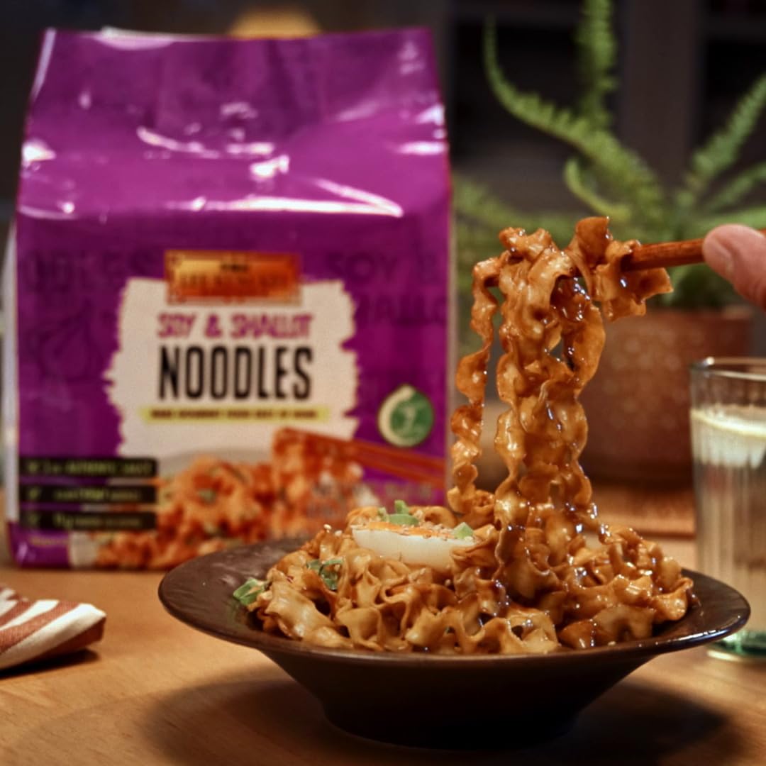 Lee Kum Kee noodles with vegetables on a cutting board, quick weeknight dinner idea.