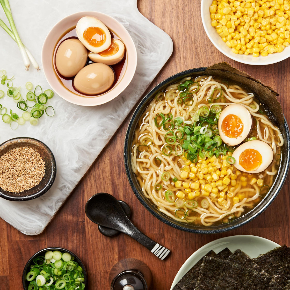 Lee Kum Kee Less Sodium Soy Sauce poured over noodles for balanced seasoning