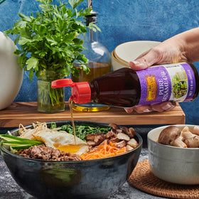 Lee Kum Kee Pure Sesame Oil kitchen scene emphasizing versatility