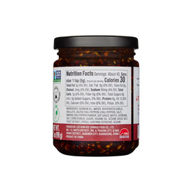 Lee Kum Kee Smoky Chili Crisp pour stream adding smoky heat to noodles.
