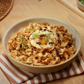 Lee Kum Kee 3-in-1 sauce bowl showcases flavor base for rich noodles.