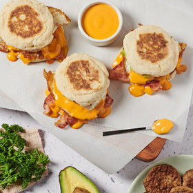 Lee Kum Kee Sriracha Mayo drizzle over a burger for bold flavor
