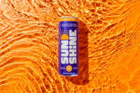 Legendary Sunshine Clementine Twist sparkling bubbles close-up, crisp low-calorie pick-me-up