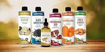 Lekithos Pomegranate Seed Oil bottle beside a glass smoothie, versatile wellness option.