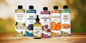 Lekithos Pomegranate Seed Oil bottle beside a glass smoothie, versatile wellness option.