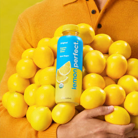 Lemon Perfect Original bottle pours into glass delivering tart flavor and natural sweetness