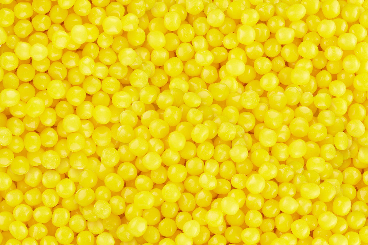 Iconic Mr. Lemonhead smiling candy with bright lemon flavor