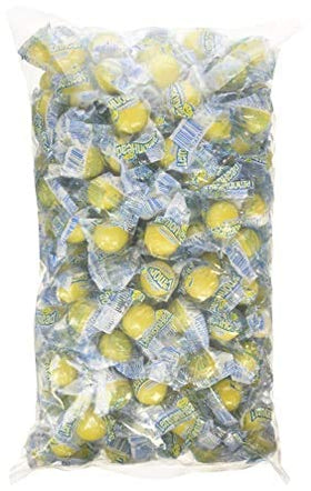 Lemonheads bulk candy closeup; vibrant lemon pieces perfect for gift baskets.