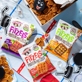 Lenny & Larry's FITZELS pizza flavor pack shot with bold, smoky notes.