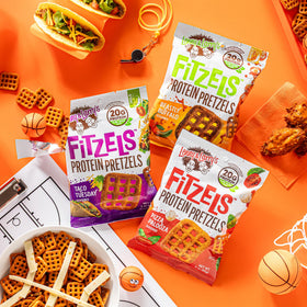 Lenny & Larry's FITZELS taco flavor pack shot with zesty crunch.