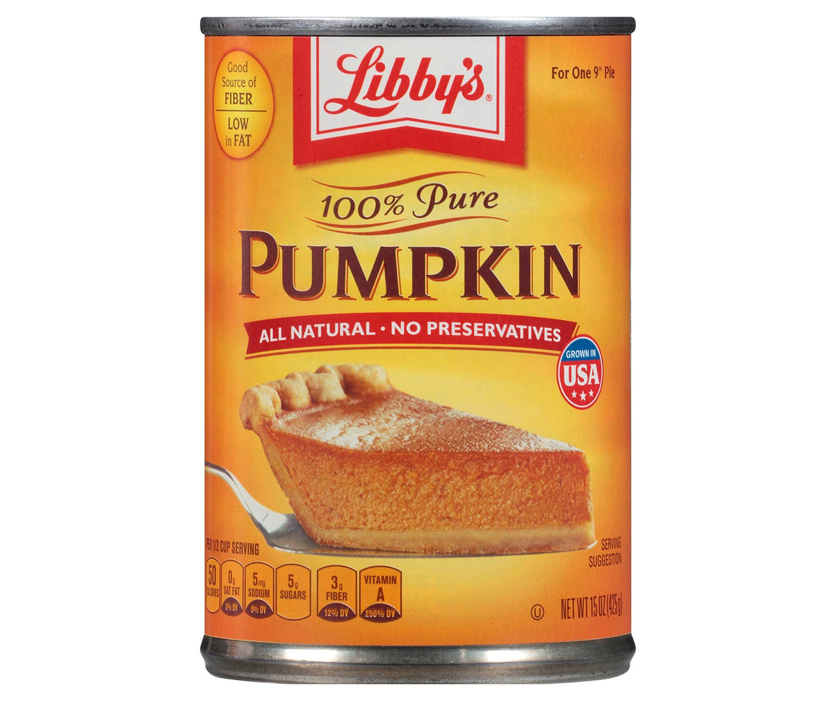 Libby's pumpkin puree in an open can, silky texture for pies and desserts.