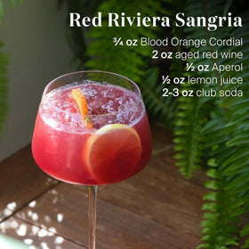 Liber & Co Blood Orange Syrup ingredients close-up emphasizes Moro orange juice and pure cane sugar.