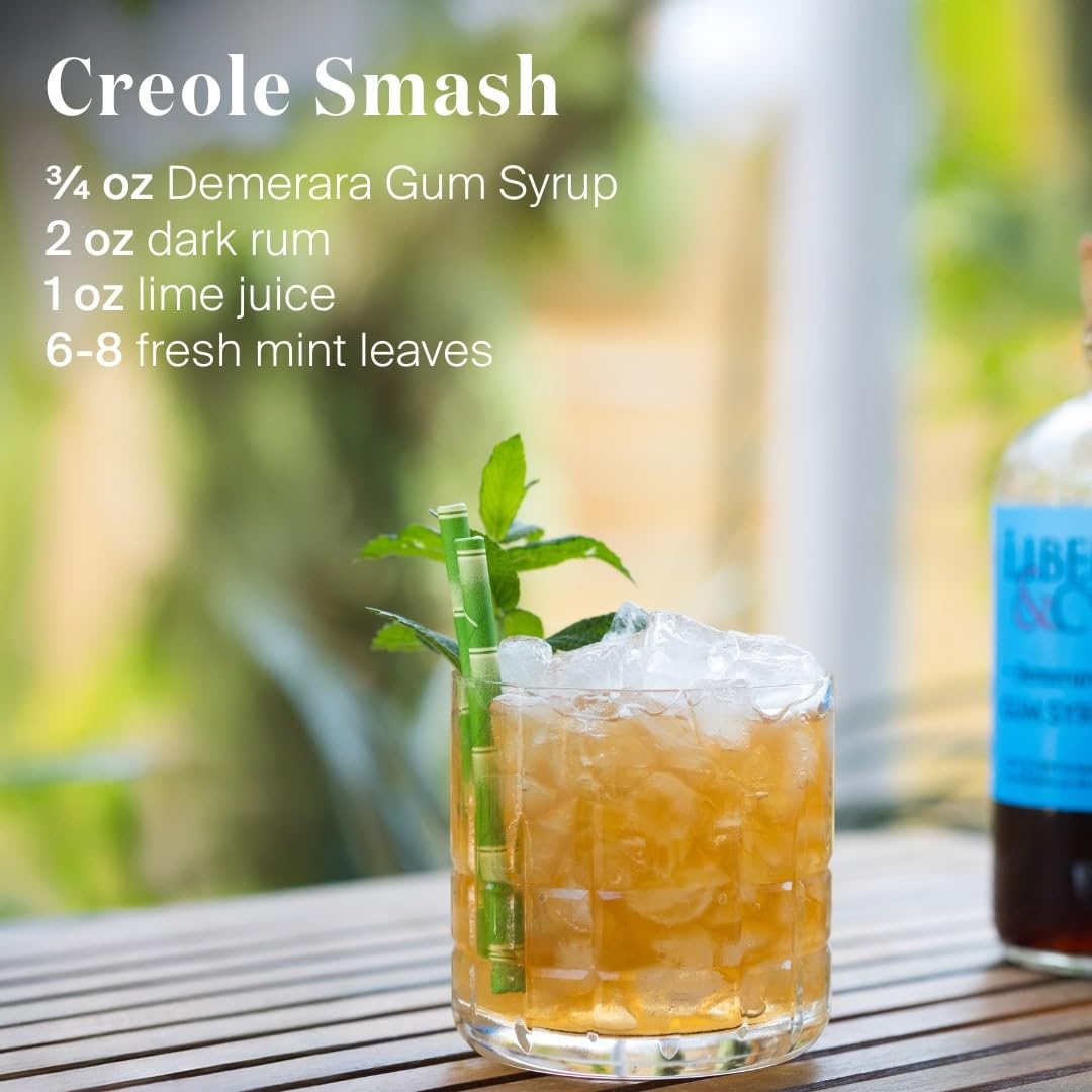 Liber & Co. Demerara Gum Syrup pours into glass, showcasing velvety sweetness.