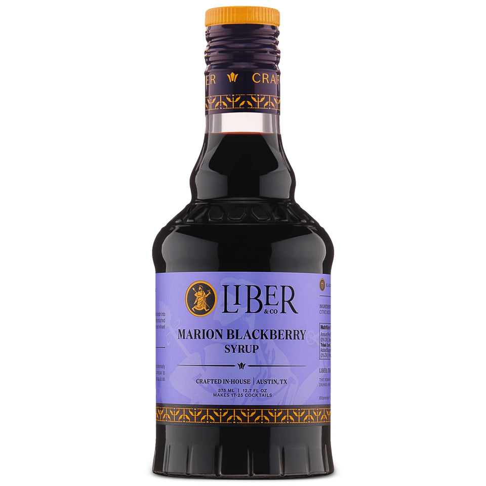 Liber & Co. Marion Blackberry Syrup bottle on bar, ready for cocktails.