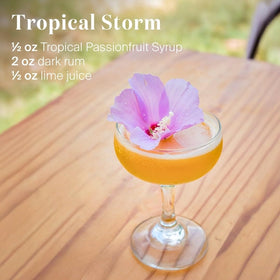 Liber & Co Tropical Passion Fruit Syrup in a hurricane mix for tropical flavor.
