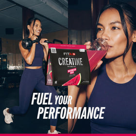 Glass with mixed FITAID Creatine Watermelon Rush showing refreshing color and texture.