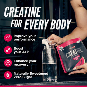 Scoop of FITAID Creatine Watermelon Rush powder ready to mix.