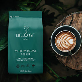 Lifeboost Coffee Ground Medium Roast bag closeup shows USDA Organic label and non-GMO promise.