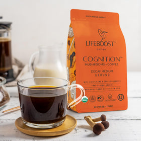 Lifeboost Cognition coffee bag beside a cup suggesting a mindful daily routine.