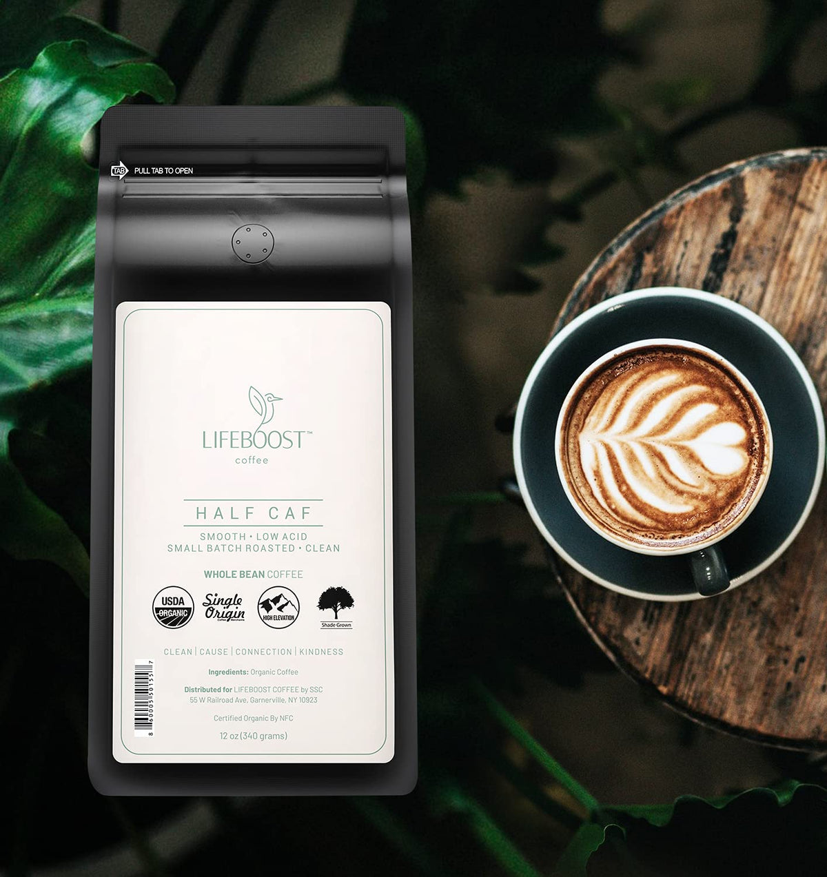 Lifeboost Half Caff coffee beans close-up highlighting hand-sorted, shade-grown quality.