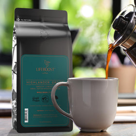 Lifeboost Highlander Grogg packaging on shelf, emphasizing sustainable, shade-grown origins.