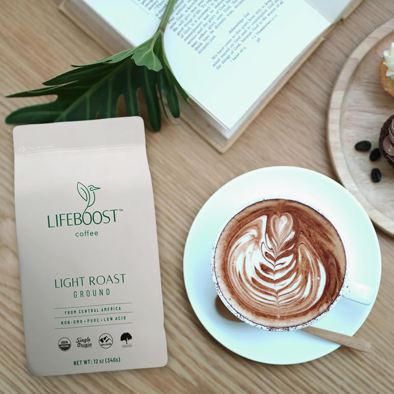 Person enjoying Lifeboost Light Roast Ground Coffee with a bright, clean finish