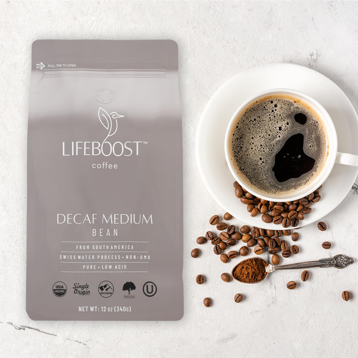Lifeboost tasting cup steam rising from decaf coffee