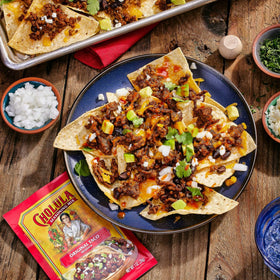 Lime over Cholula-seasoned tacos for fresh zest.