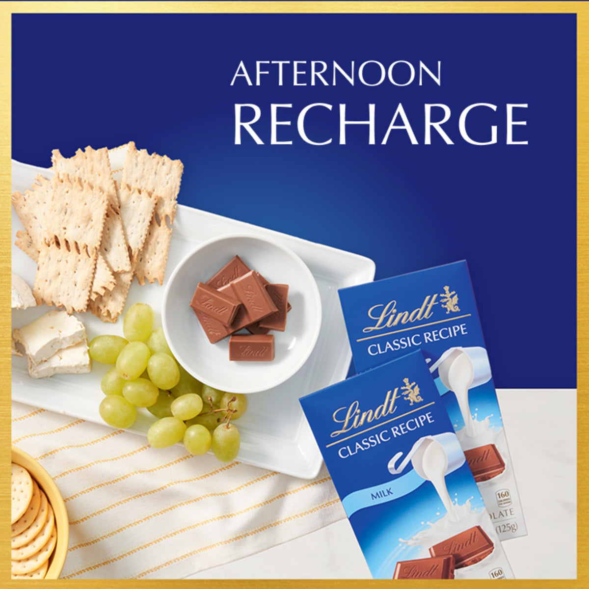 Lindt CLASSIC RECIPE Milk Chocolate Bar unwrapped slice ideal for snacking.
