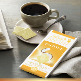 Lindt EXCELLENCE coconut white chocolate bar slices show pre-portioned pieces for balanced enjoyment.