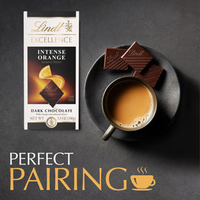 Lindt EXCELLENCE Intense Orange bar closeup reveals glossy dark chocolate and citrus.