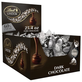 Lindt Lindor 60% dark chocolate truffles shell close-up, premium flavor.