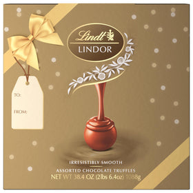 Lindt LINDOR Caramel Milk Chocolate Truffle closeup with silky center for melt-in-mouth moments.