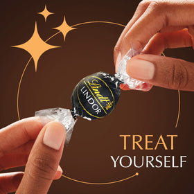 Lindt Lindor 60% truffles close-up highlights a smooth melting center.