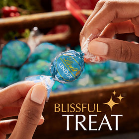 Close-up of Lindor Milk Chocolate Salted Caramel centers, showcasing creamy texture.