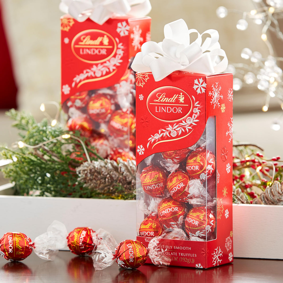 Lindt Lindor Milk Chocolate Truffles shell close-up, smooth melt promise.