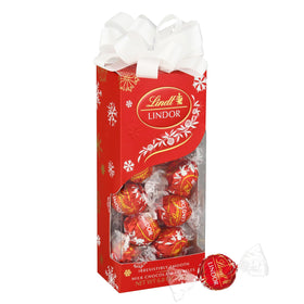 Lindt Lindor Milk Chocolate Truffles Traditions Gift Box on festive red packaging, ideal for gifting.