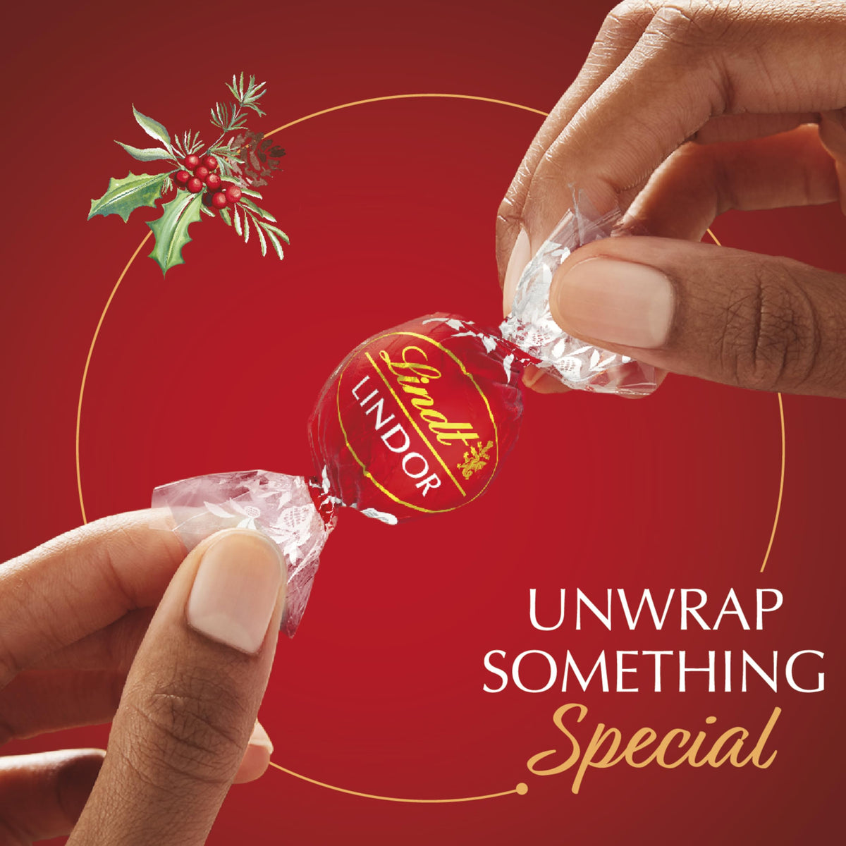 Lindt Lindor gift box in festive red with a white bow, ready for gifting.