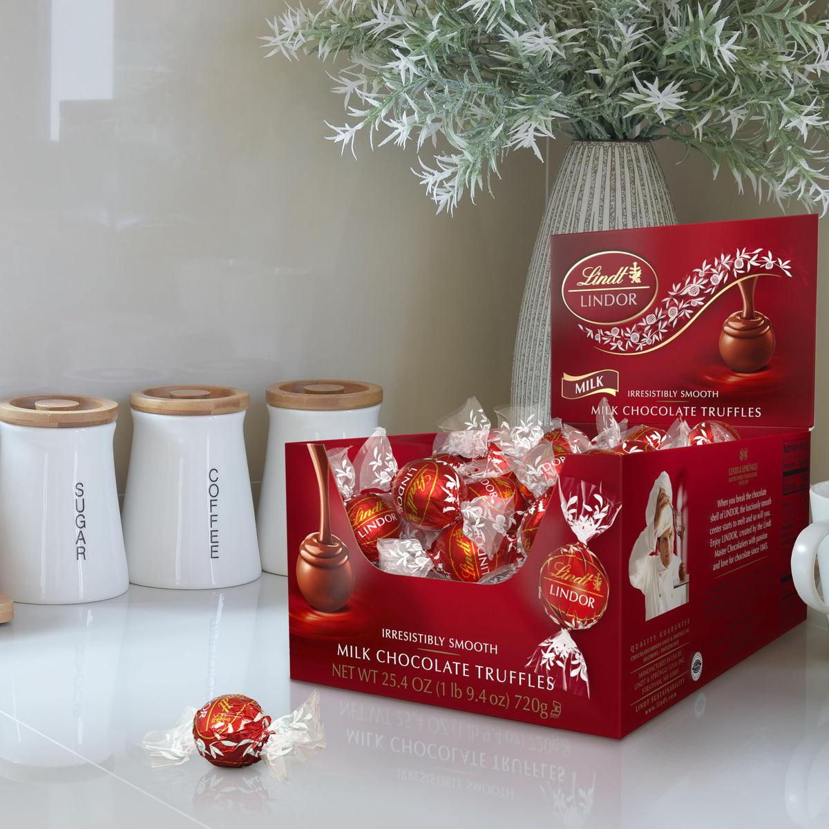 Lindt LINDOR truffle center melting, inviting smooth texture.